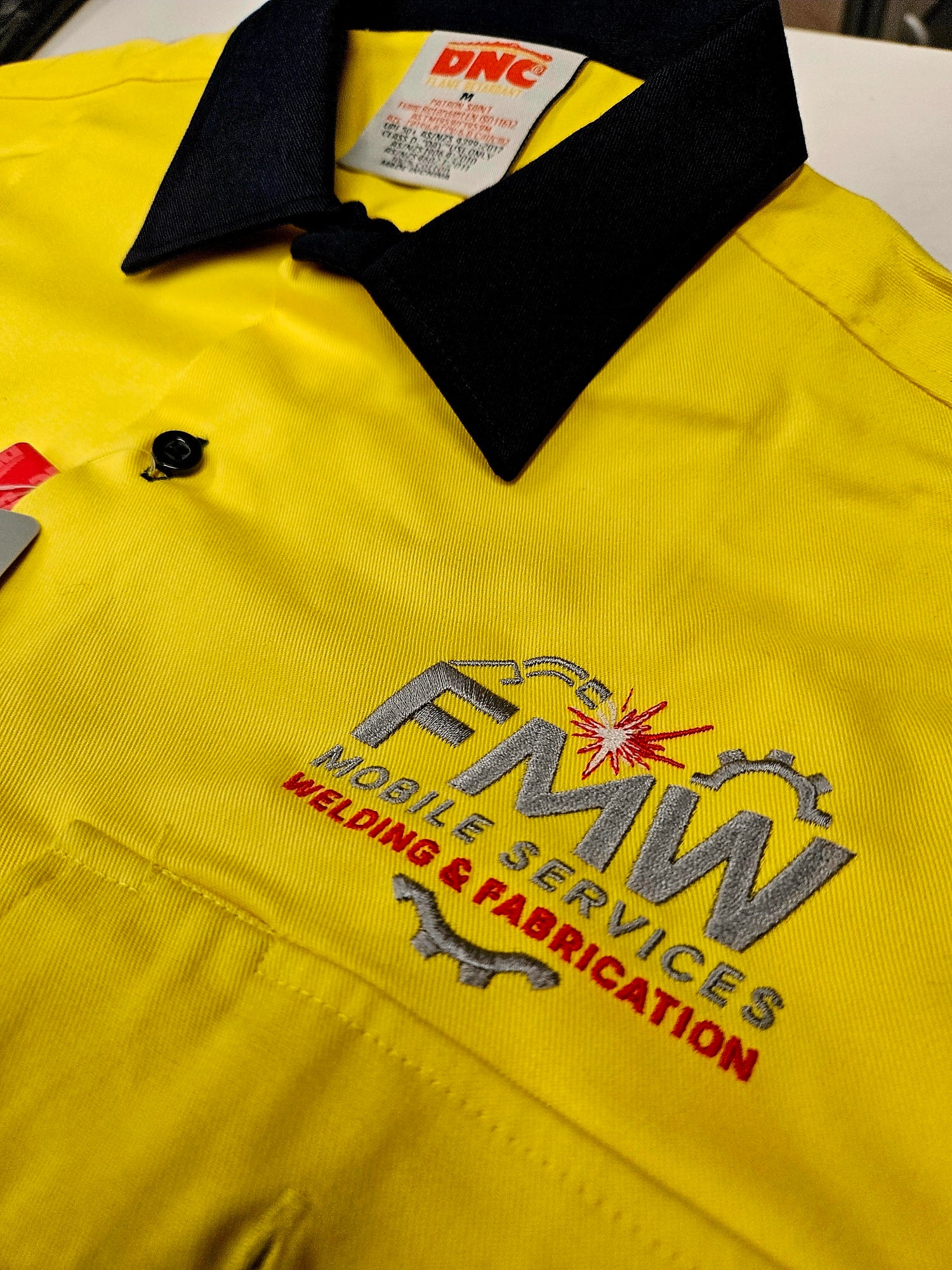 Custom workwear shirt with embroidered FMW Mobile Services
